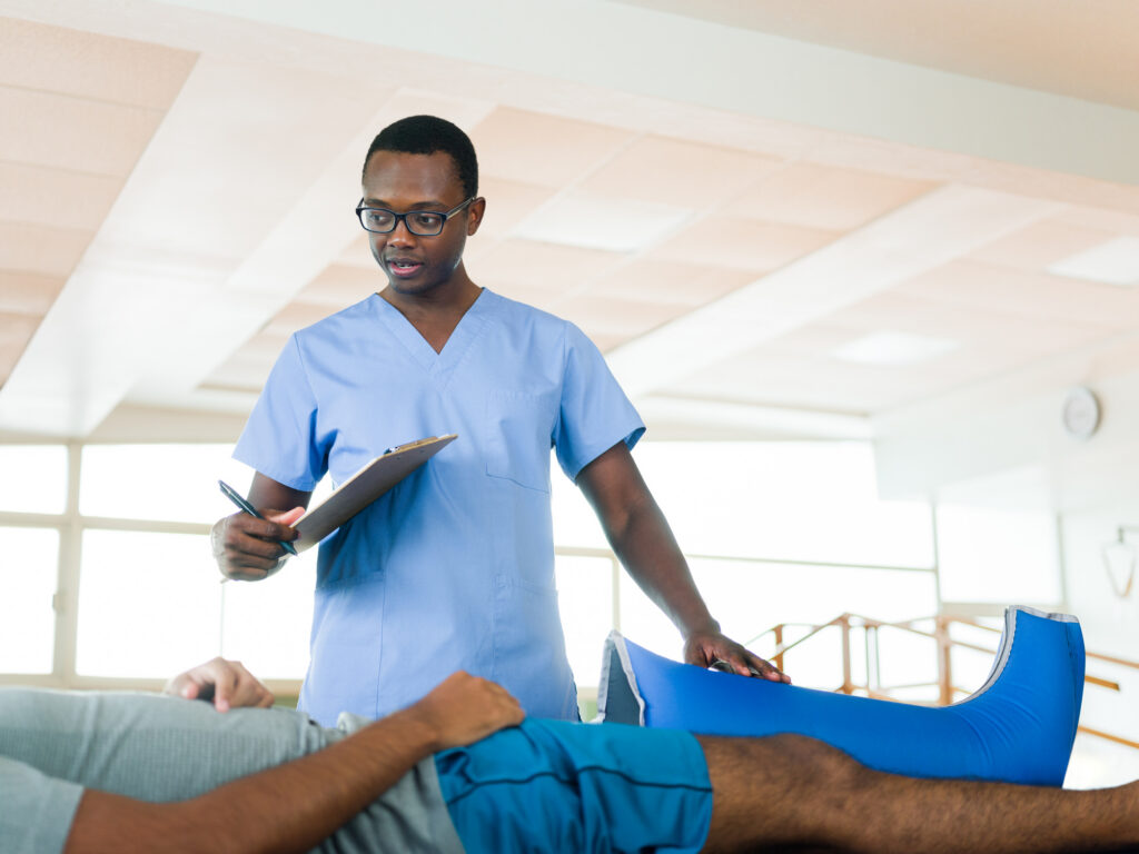 Healthcare provider discussing a personalized physical therapy treatment plan with a patient recovering from injuries after a car accident.
