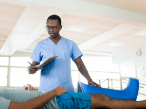 Healthcare provider discussing a personalized physical therapy treatment plan with a patient recovering from injuries after a car accident.