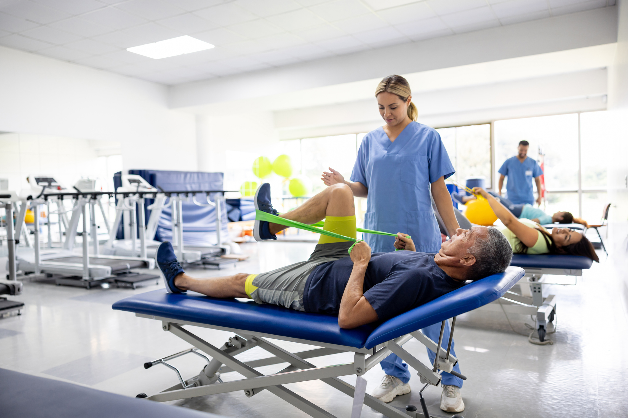 Physiotherapist guiding a patient through therapeutic exercise during car accident rehabilitation in Port Charlotte, Florida