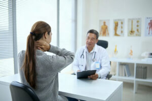 Healthcare provider evaluating a patient after a weekend car accident at a Florida injury clinic.